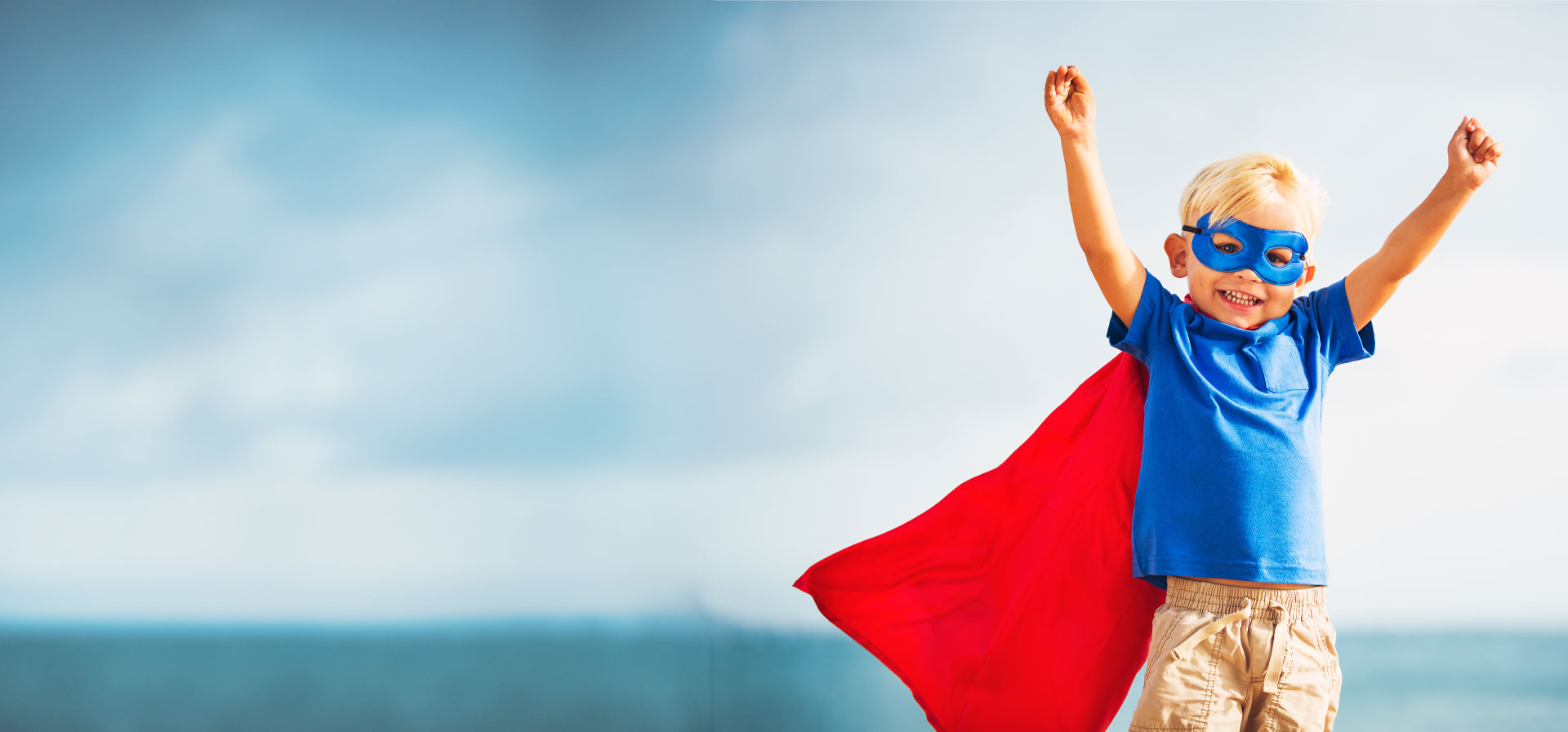 Child wearing super hero costume