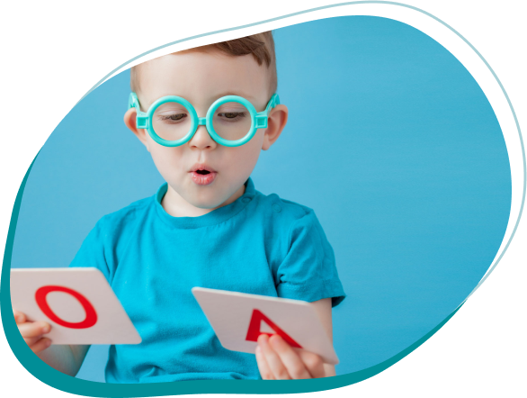 a child wearing blue glasses holding a card